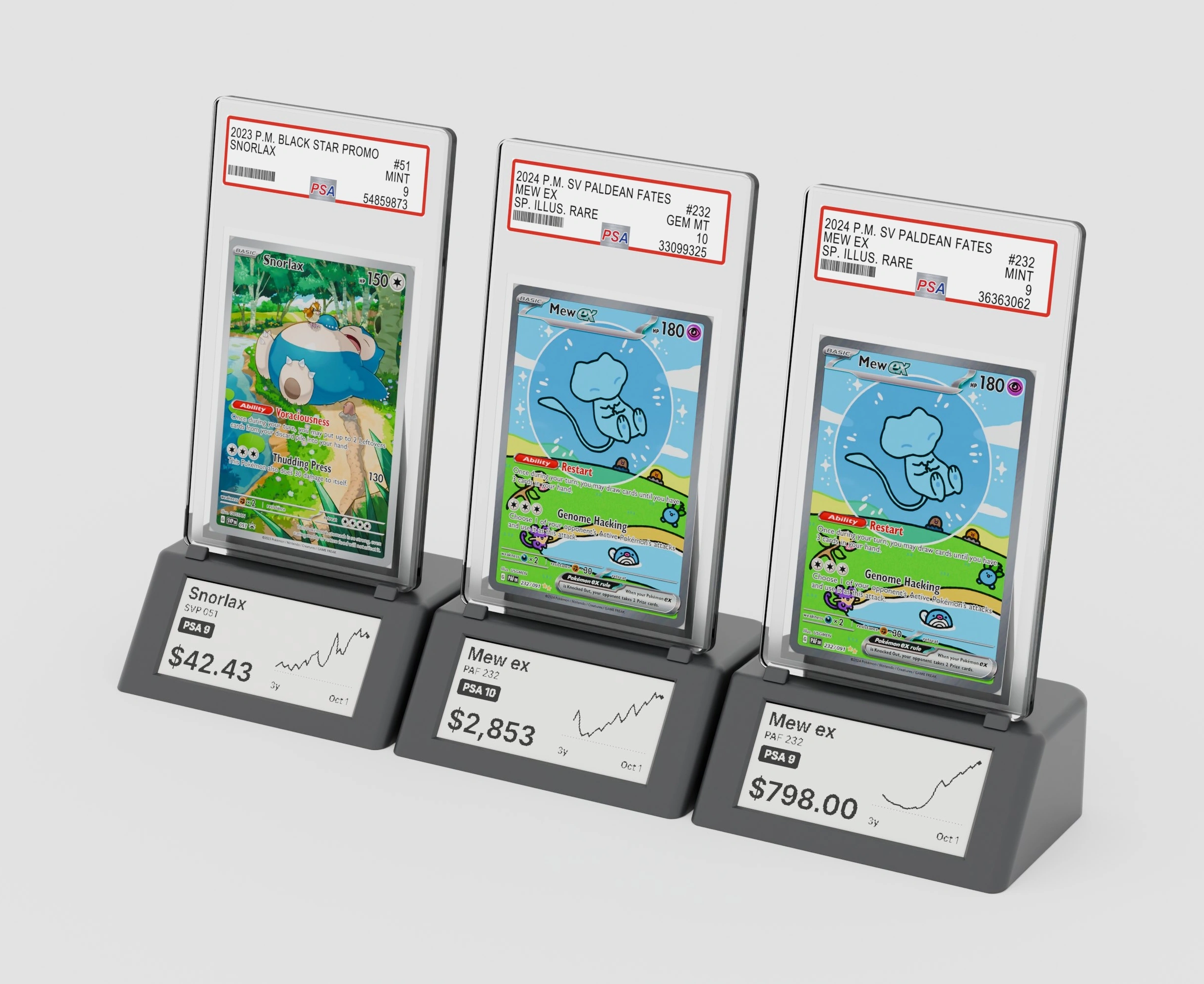 Three Gradient stands side by side: Snorlax PSA 9, Mew ex PSA 10 and Mew ex PSA 9, each screen showing its price